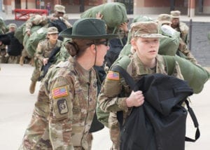 A U.S. Army drill sergeant corrects a recruit during her first day of training at Fort Leonard Wood, Mo., Jan. 31, 2017. Referred to as “Day Zero” this marks the beginning of the recruit's journey through Basic Combat Training, where she will transition from a civilian to a Soldier.