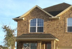 Spc. Sergio Trejo and his family stand outside their new home in Houston. The "Helping A Hero" troop support group presented the home to the family, December 2008.