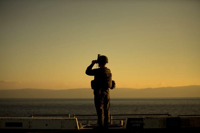 Lance Corporal Mohamad Jrad, a low-altitude air defense gunner with the 24th Marine Expeditionary Unit, surveys the shores of Morocco aboard the USS New York, at sea, Dec. 25, 2014. Jrad was part of a defensive posture for the ship as it sailed through the Strait of Gibraltar on its way into the Mediterranean Sea. The Iwo Jima Amphibious Ready Group/24th Marine Expeditionary Unit, is conducting naval operations in the U.S. 6th Fleet area of operations in support of U.S. national security interests in Europe. (U.S. Marine Corps photo by Cpl. Todd F. Michalek)