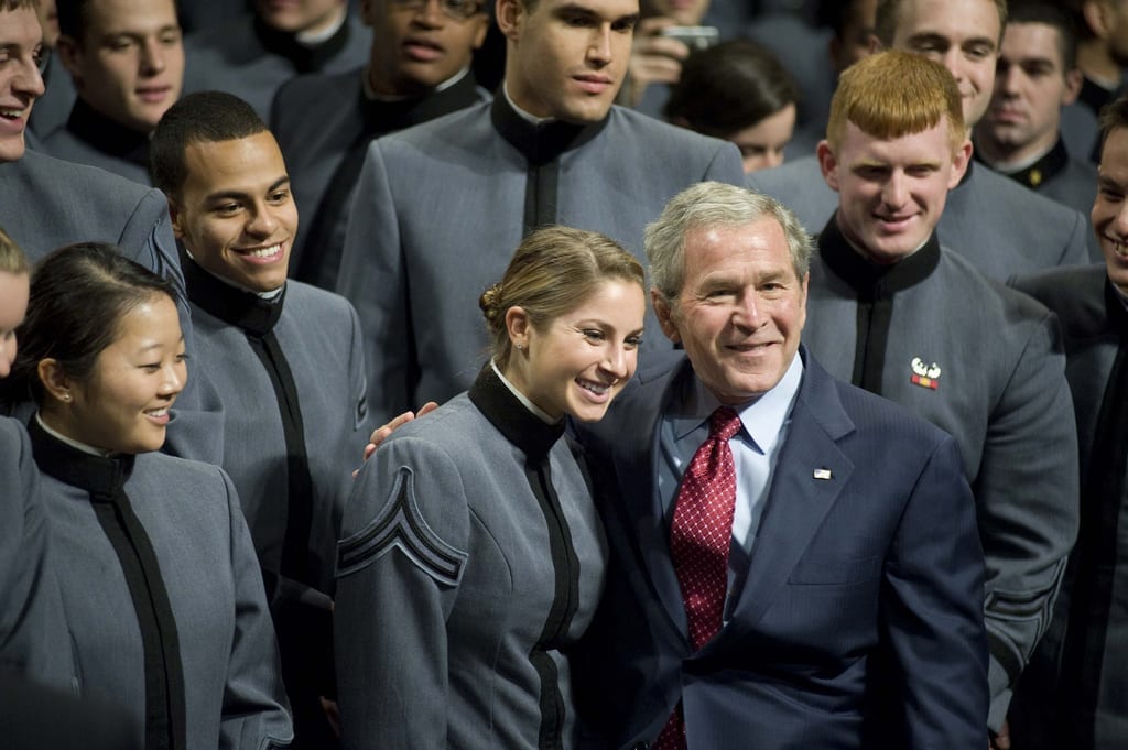 President George W. Bush takes a photo opportunity with a cadet at Eisenhower Hall following his address to the Corps of Cadets Tuesday.