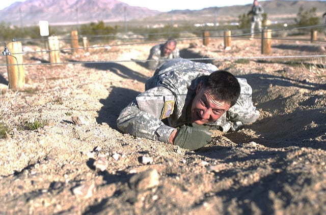 1st Lt. Michael Keyser, A Troop, 1st Squadron, 11th Armored Cavalry Regiment, crawls through an obstacle during Pre-Ranger Assessment Course, March 1.