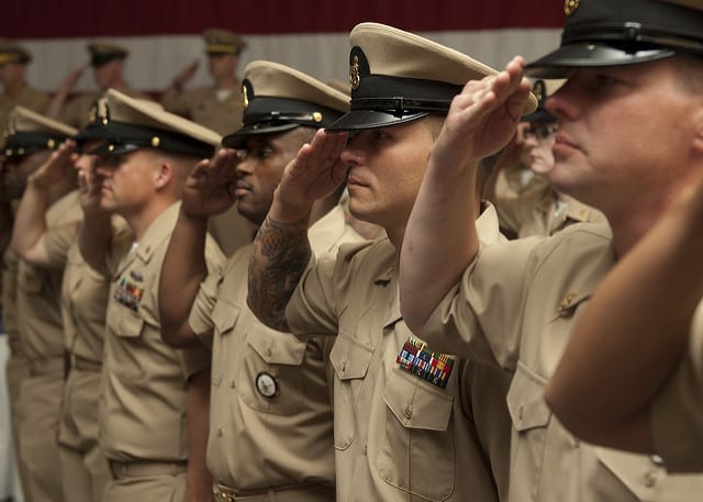 EVERETT, Wash. (Sept. 14, 2012) Newly-pinned chief petty officers salute during a chief petty officer pinning ceremony in the Grand Vista Ballroom at Naval Station Everett. The Naval Station welcomed 24 newly pinned Sailors to the rank of chief petty officer during the ceremony. (U.S. Navy Photo by Mass Communication Specialist 2nd Class Jeffry Willadsen/Released) 120914-N-MM360-103