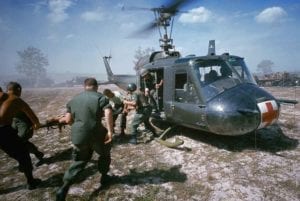 ca. 1968, south of Dunang, Vietnam --- A helicopter airlifts wounded victims of a booby trap explosion. Such resues were known as dust-offs. --- Image by © Tim Page/CORBIS