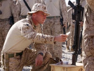 NAWA, Helmand Province, Islamic Republic of Afghanistan  Staff Sgt. David A. Schaefer, platoon sergeant, 3rd Platoon, Bravo Company, 1st Battalion, 3rd Marine Regiment, touches the dog tags of Lance Cpl. Jacob A. Meinert before saying a silent prayer during a memorial ceremony at Forward Operating Base Spin Ghar Jan. 20. Meinert, 20, from Fort Atkinson, Wis., served in 3rd Platoon and was killed Jan. 10 while conducting combat operations in Afghanistans Helmand province. (Official Marine Corps photo by Sgt. Brian A. Tuthill)