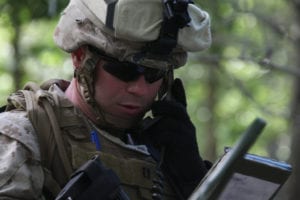 Capt. Brian J. Donlon, Company I commander with Battalion Landing Team 3/8, 26th Marine Expeditionary Unit, communicates on the company radio during a company battle live-fire exercise as part of Realistic Urban Training aboard Fort A.P. Hill, Va., June 8, 2010. During the 18-day training evolution, the MEU will conduct several urban and other small unit training exercises as part of its pre-deployment training. 26th MEU is scheduled to deploy later this fall. (Official USMC Photo by Lance Cpl. Santiago G. Colon Jr./Released)