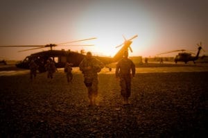 (Left) Gen. James D. Thurman, U.S. Army Forces Command, commanding general, walks with Col. Erik Peterson, International Security Assistance Force - Regional Command South and 10th Mountain Division chief of staff, from his helicopter on Kandahar Airfield, Afghanistan, Jan. 12, after a day of visiting various units in southern Afghanistan. The purpose of his trip was to see various units and discuss matters related to pre-deployment training. (U.S. Army photo by Spc. Edward A. Garibay, 16th Mobile Public Affairs Detachment)