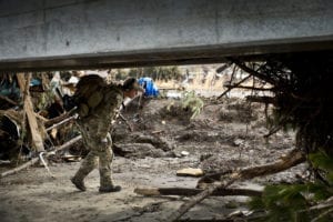 U.S. Air Force Senior Airman Steven Nizbet, a 320th Special Tactics Squadron (STS) pararescueman, looks for trapped survivors at Sendai Airport, Japan, March 16, 2011. Members of the 320th STS from Kadena Air Base, Japan, deployed to Sendai Airport to help clear the runway and make it ready for fixed-wing aircraft traffic. (U.S. Air Force photo by Staff Sgt. Samuel Morse)