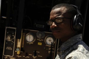 U.S. Air Force Airman 1st Class Reuben Chisholm, 7th Logistics Readiness Squadron, operates a fuel truck while refueling a C-130H Hercules from the 302nd Airlift Wing, Colorado Air Force Reserve, at Dyess Air Force Base, Texas, April 28, 2011. The C-130 is equipped with the Modular Airborne Firefighting System housed aboard a C-130 Hercules which is capable of dispensing 3,000 gallons of water or fire retardant in under five seconds. The 7th Bomb Wing has been supporting the 302nd AW and the 146th AW, California Air National Guard, with flightline operations while at Dyess AFB. (U.S. Air Force Photo by Staff Sgt. Eric Harris/Released)