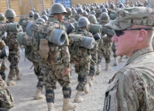 U.S. Army Cpl. William Metz, a Clearwater, Fla., native, now a team leader and adviser with 3rd Battalion, 4th Infantry Regiment, 170th Infantry Brigade Combat Team, watches as Afghan National Army recruits finish a march at the Kabul Military Training Center Sept. 19, 2011. Soldiers with 3-4 Infantry advise Afghan National Army trainers throughout the country.