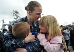 110319-N-YB753-170<br /> SAN DIEGO (March 19, 2011) Mass Communication Specialist 1st Class Sarah Murphy embraces her children upon return from a deployment aboard the aircraft carrier USS Abraham Lincoln (CVN 72). The Abraham Lincoln Carrier Strike Group stopped in San Diego on its way home to Everett, Wash., following more than six months deployed in the U.S. 5th and 7th Fleet areas of responsibility supporting maritime security operations and theater security cooperation efforts. (U.S. Navy photo by Mass Communication Specialist 2nd Class Brian Morales/Released)