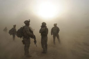 Sgt. 1st Class Lance Amsden, platoon sergeant for the 1st Platoon, Company C, 1st Battalion, 501st Infantry Regiment, 4th Brigade Combat Team (Airborne), 25th Infantry Division, watches as CH-47 Chinook Helicopters circle above during a dust storm at Forward Operating Base Kushamond, Afghanistan, July 17, during preparation for an air-assault mission.