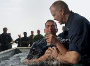 110508-N-DR144-024<br /> ARABIAN SEA (May 8, 2011) Lt. Jeffrey Ross, a chaplain aboard the Nimitz-class aircraft carrier USS Carl Vinson (CVN 70), baptizes Aviation Boatswain's Mate (Fuel) Airman Jovan Michel. Carl Vinson and Carrier Air Wing (CVW) 17 are underway in the U.S. 7th Fleet area of responsibility. (U.S. Navy photo by Mass Communication Specialist 2nd Class James R. Evans/Released)