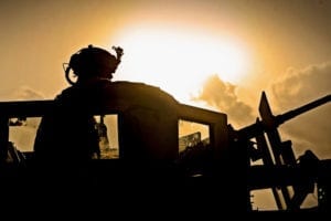 Spc. John "Rocky" Montoya, M2 gunner attached to Laghman Provincial Reconstruction Team, scans his sector of fire while on a combat patrol to sweep for roadside bomb triggermen in Alingar District, Laghman Province, Aug. 8. The PRT is serving as the Quick Reaction Force, ready to respond at a moment's notice to unexpected incidents in the province. The QRF was called up to escort the explosives ordinance disposal team to a found IED site while clearing previous blast sites along the way. (U.S. Air Force photo/ Staff Sgt. Ryan Crane)