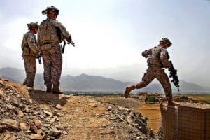 Lt. Col. Mark O'Donnell, right, commander of 1st Battalion, 32nd Infantry Regiment, makes his way to a firing position to talk to Soldiers on Vehicle Patrol Base Badel, Konar province, Afghanistan, Aug. 14. O'Donnell and his Command Sgt. Maj. were on a routine mission to communicate face to face with their junior leaders.