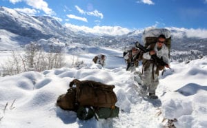 Lance Cpl. Eleanor H. Roper (right), a Monroe, Wis., native and field radio operator with Ragnarok Company, 2nd Supply Battalion, 2nd Marine Logistics Group, pulls a Marine Corps Cold Weather Infantry Kit, or MCCWIK sled up a slope during a field exercise aboard Marine Corps Mountain Warfare Training Center, Bridgeport, Calif., Jan. 31, 2014. The MCCWIK allows service members to move equipment over snow-covered terrain that vehicles are unable to traverse.<br /> (U.S. Marine Corps photo by Lance Cpl. Sullivan Laramie/Released)