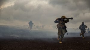 U.S. Marines with Weapons Company, 3rd Battalion, 3rd Marine Regiment maneuver from a chemically gassed area during Exercise Bougainville II at the Pohakuloa Training Area, Island of Hawaii, Oct. 20, 2018. Exercise Bougainville II is the 2nd part of the pre-deployment workup focusing on platoon and company level exercises. (U.S. Marine Corps photo by Sgt. Ricky Gomez)