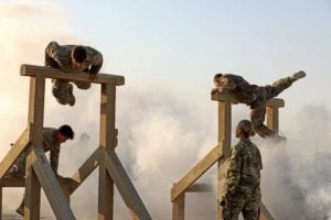 Soldiers from 1st Battalion, 8th Infantry Regiment, 3rd Armored Brigade Combat Team, 4th Infantry Division, complete the "Gut Buster" obstacle at the Camp Buehring, Kuwait Air Assault obstacle course on Thursday, June 6, 2019. The Soldiers, currently deployed in support of Operation Spartan Shield, completed the course in small teams in memory of the 1-8 Soldiers who landed on Utah Beach as part of the D-Day invasion of Normandy. U.S. Army photo by Sgt. Liane Hatch