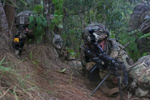 Soldiers assigned to 4th Infantry Brigade Combat Team, 25th Infantry Division stationed at Joint Base Elmendorf-Richardson, Alaska take aim at an enemy position during Courage Ready 19 on Kahuku Training Area, Hawaii, June 4, 2019. Courage Ready is an emergency deployment readiness exercise conducted in conjunction with Lightning Forge 19 to enhance IBCT readiness for future operations in the pacific. (U.S. Army photo by Sgt. Brandon Franklin/55th Combat Camera)