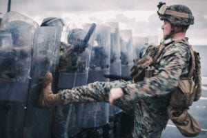 190321-M-QS181-0036 PACIFIC OCEAN (March 21, 2019) U.S. Marine Corps Sgt. Alexander Anninos, an assistant operations chief with Alpha Battery, Battalion Landing Team 3/5, 11th Marine Expeditionary Unit (MEU), kicks a riot shield during civil defense, riot control training aboard the San Antonio-class amphibious transport dock ship USS John P. Murtha (LPD 26). The Marines and Sailors of the 11th Marine Expeditionary Unit are conducting routine operations as part of the Boxer Amphibious Ready Group in the eastern Pacific Ocean. (U.S. Marine Corps photo by Lance Cpl. Jason Monty)