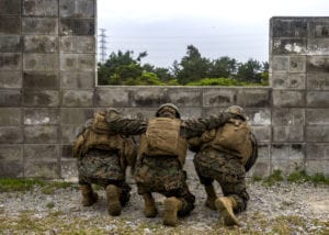 U.S. Marines assigned to Headquarters Battery, 12th Marine Regiment, 3rd Marine Division, practice throwing grenades at Camp Hansen in Okinawa, Japan, Feb. 26, 2020. The Marines were participating in a grenade range in order to maintain their knowledge and lethality with M67 grenades. (U.S. Marine Corps photo by Cpl. Savannah Mesimer)