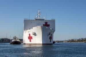 LOS ANGELES (March 27, 2020) The Military Sealift Command hospital ship USNS Mercy (T-AH 19) arrives in Los Angeles, March 27, 2020. Mercy deployed in support of the nation’s COVID-19 response efforts, and will serve as a referral hospital for non-COVID-19 patients currently admitted to shore-based hospitals. This allows shore base hospitals to focus their efforts on COVID-19 cases. One of the Department of Defense’s missions is Defense Support of Civil Authorities. DoD is supporting the Federal Emergency Management Agency, the lead federal agency, as well as state, local and public health authorities in helping protect the health and safety of the American people. (U.S. Navy photo by Mass Communication Specialist 1st Class David Mora Jr./Released) 200327-N-UV609-1043