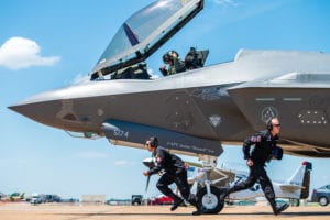 F-35 Lightning II demonstration team members sprint to their positions during the ground show at the Defenders of Liberty Air &amp; Space Show at Barksdale Air Force Base, La., May 17, 2019. The team’s ground show consists of pre-flight inspections with sharp, quick-paced movements that showcase the pride and professionalism of the U.S. Air Force. (U.S. Air Force photo by Senior Airman Alexander Cook)