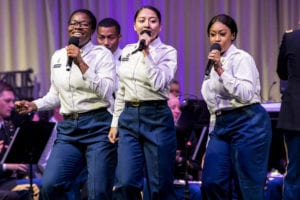 U.S. Army Spc. Stephenia Ozokwere, Spc. Ana Rodriguez and Spc. Brianna Richardson, U.S. Army Europe Band and Chorus, performs during the playing of “Dancing in the Street” at the German American friendship concert, Kaiserslautern, Germany, Oct. 3, 2019. The U.S. Army Europe Band and Chorus presented the German American friendship concert to celebrate a year of musical collaboration to foster a strong relationship among the community. (U.S. Army photo by Sgt. Apolonia L. Gaspar)