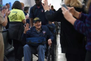 World War II Army veteran David Friedrich arrives to a hero’s welcome at Reagan National Airport, Arlington, Va., Dec. 6, 2018. Friedrich was part of a special Honor Flight from Austin, Texas, that brought World War II veterans to the nation’s capital for the 77th anniversary of Pearl Harbor. (DoD photo by Lisa Ferdinando)