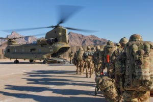 Soldiers attached to the 101st Resolute Support Sustainment Brigade from the 1034th Combat Sustainment Support Battalion, Iowa National Guard and 10th Mountain, 2-14 Infantry Battalion, Ghost Forward Support Company load onto a Chinook helicopter to head out and execute missions across the Combined Joint Operations Area- Afghanistan