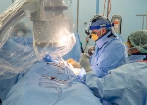 LOS ANGELES (April 29, 2020) Cmdr. Andrew Kaplan, a cardiac electrophysiologist from Phoenix, sutures a patient aboard the hospital ship USNS Mercy (T-AH 19), April 29, 2020. Mercy deployed in support of the nation's COVID-19 response efforts, and serves as a referral hospital for non-COVID-19 patients currently admitted to shore-based hospitals. This allows shore base hospitals to focus their efforts on COVID-19 cases. One of the Department of Defense's missions is Defense Support of Civil Authorities. DoD is supporting the Federal Emergency Management Agency, the lead federal agency, as well as state, local and public health authorities in helping protect the health and safety of the American people. (U.S. Navy photo by Mass Communication Specialist 3rd Class Jake Greenberg/Released)200429-N-DA693-1194