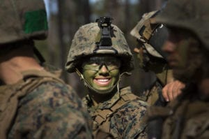 Pfc. Christina Fuentes Montenegro and other Marines from Delta Company, Infantry Training Battalion , School of Infantry-East, receive final instructions prior to assaulting an objective during the Infantry Integrated Field Training Exercise aboard Camp Geiger, N.C., Nov 15, 2013. Montenegro is one of three female Marines to be the first women to graduate infantry training with the battalion. Delta Company is the first company at ITB with female students as part of a measured, deliberate and responsible collection of data on the performance of female Marines when executing existing infantry tasks and training events, the Marine Corps is soliciting entry-level female Marine volunteers to attend the eight week basic infantryman and infantry rifleman training courses at ITB. (U. S. Marine Corps photo by CWO2 Paul S. Mancuso/Released)