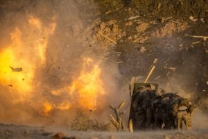 180708-M-IZ659-0304 CAMP TITIN, Jordan (July 8, 2018) U.S. Marines assigned to Combat Logistics Battalion-26 (CLB-26), 26th Marine Expeditionary Unit (MEU), take cover from demolitions during sustainment training at Camp Titin, Jordan, July 8, 2018. Iwo Jima is the flagship for the Iwo Jima Amphibious Ready Group and, with the embarked 26th Marine Expeditionary Unit, is deployed to the U.S. 5th Fleet area of operations in support of naval operations to ensure maritime stability and security in the Central region, connecting the Mediterranean and the Pacific through the western Indian Ocean and three strategic choke points. (U.S. Marine Corps photo by Cpl. Santino D. Martinez/Released)