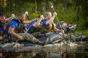 Paratroopers from Company A, forefront, and Company B, rear, compete against each other during the 307th Airborne Engineer Battalion’s commemoration of the 74th anniversary of the Waal River Crossing on Wednesday, October 3, 2018 on Fort Bragg’s McKellar’s Pond. The paratroopers were competing to cross the lake five times in honor of Pfc. Willard Jenkins, killed by enemy fire while manning a rudder during the WWII river assault.