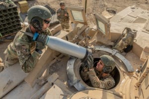 Armor crewmen assigned to Task Force Raider load Sabot rounds onto a M1 Abram Tank during a pre-deployment training exercise at Fort Hood, Texas, August 18. Sabot rounds work like a basic arrow by penetrating armor with momentum of force rather than explosive power. (Photo by U.S. Army Sgt. Sarah Kirby)