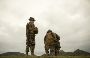 Marines await their turn to shoot the table two portion of their annual rifle range qualification, Jan. 12, 2017, at Camp Hansen, Okinawa, Japan. The Marine Corps revised table two of the marksmanship program October 2016 to increase marksmanship skill and realism in a combat environment. The Corps requires Marines to annually qualify at the range to determine their marksmanship skill. (U.S. Marine Corps photo by Lance Cpl. Andy Martinez)