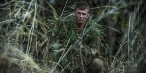 U.S. Marine Lance Cpl. William Pearn, a Shohola, Pennsylvania native, camouflages himself using surrounding vegetation during exercise Forest Light 17-1 at Somagahara, Japan, March 10, 2017. Forest Light is one of various bi-lateral training opportunities conducted by Japan Ground Self-Defense and deployed U.S. Marine forces to demonstrate the enduring commitment by both countries to peace, stability, and prosperity across the region. Pearn is a machine gunner trainer for scout sniper school with Company G, 2nd Battalion, 3rd Marine Regiment, 3rd Marine Division, III Marine Expeditionary Force. (U.S. Marine Corps photo by Sgt. Isaac Ibarra)