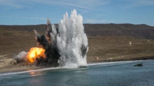 A U.S. Marine Corps amphibious assault vehicle with 1st Combat Engineer Battalion, 1st Marine Division, fires a mine clearing line charge during a simulated amphibious breach in support of exercise Steel Knight 2018 at San Clemente Island, Calif., Dec. 9, 2017. Steel Knight is a 1st Marine Division led exercise enabling Marines and Sailors to operate in a realistic environment developing necessary skill sets to maintain a fully capable Marine Air Ground Task Force. (U.S. Marine Corps photo by LCpl. Rhita Daniel)