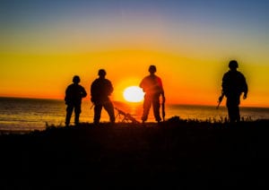 U.S. Marines with Combat Logistics Battalion 11, Headquarters Regiment, 1st Marine Logistics Group, overlook the beach during a field exercise at Camp Pendleton, Calif., Dec. 12, 2017. The Marines had continuous security to simulate a forward deployed environment. (U.S. Marine Corps photo by Lance Cpl. Adam Dublinske)