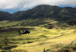 U.S. Army AH-64D Apache helicopter, assigned to the 25th Infantry Division, flies in formation for the 25th Infantry Division Review over Schofield Barracks, Hawaii, December 21, 2018. The Division’s activation date is October 1, 1941. Due to a robust training schedule in October, the Division is celebrating its birthday from December 17-21 with the culminating event being the Division Review at historic Weyand Field. More than 11,000 Tropic Lightning Soldiers will take part in the Division Review. (U.S. Army photo by Staff Sgt. Ian Morales)