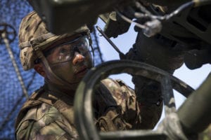 U.S. Army Sgt. Johnny Bonilla, a gunner and cannon crewmember assigned to Chaos Battery, 4th Battalion, 319th Airborne Field Artillery Regiment, 173rd Airborne Brigade, dials in a target of an M777 Howitzer during a live fire exercise as part of Saber Junction 19 (SJ19) at the 7th Army Training Command's Grafenwoehr Training Area, Germany, Sept. 11, 2019. SJ19 is an exercise involving nearly 5,400 participants from 16 ally and partner nations at the U.S. Army’s Grafenwoehr and Hohenfels Training Areas, Sept. 3 to Sept. 30, 2019. SJ19 is designed to assess the readiness of the U.S. Army’s 173rd Infantry Airborne Brigade to execute land operations in a joint, combined environment and to promote interoperability with participating allies and partner nations. (U.S. Army photo by Sgt. Thomas Mort)