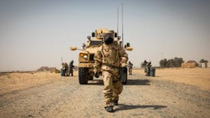 A U.S. Marine assigned to the Special Purpose Marine Air-Ground Task Force-Crisis Response-Central Command (SPMAGTF-CR-CC) 19.2, ground guides a Mine Resistant Ambush Protected All-Terrain Vehicle (M-ATV) during a chemical biological radiological nuclear (CBRN) decontamination during a Reconnaissance, Surveillance, and Decontamination Training Course in Kuwait, Apr. 22, 2020. The SPMAGTF-CR-CC is a crisis response force, prepared to deploy a variety of capabilities across the region. (U.S. Marine Corps photo by Sgt. Kyle C. Talbot)